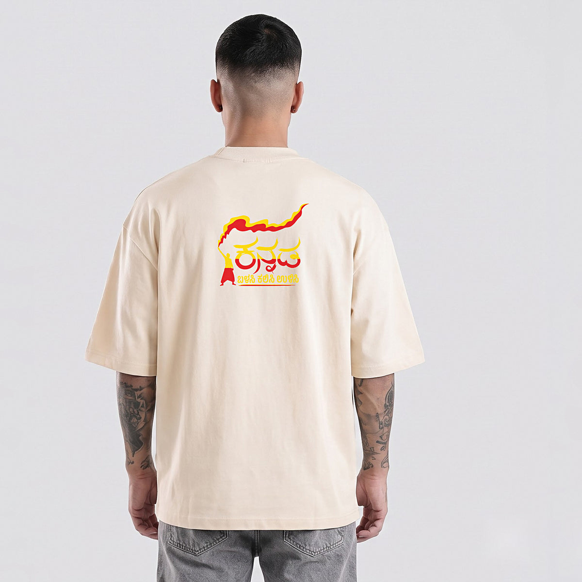 Kannada Flame Logo — Back Print, Flag Stripe Front — Bone — back view